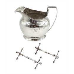 Pair of silver George III silver knive rests by William Barret II, London 1814 and silver milk jug by Alexander Field, London 1802, approx 4.5oz