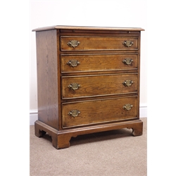  Pair of small George lll style cross banded oak bedside chests, moulded tops and brushing slides above four graduated cockbeaded drawers with brass handles, on bracket feet, W66cm, D39cm, H75cm (2)  