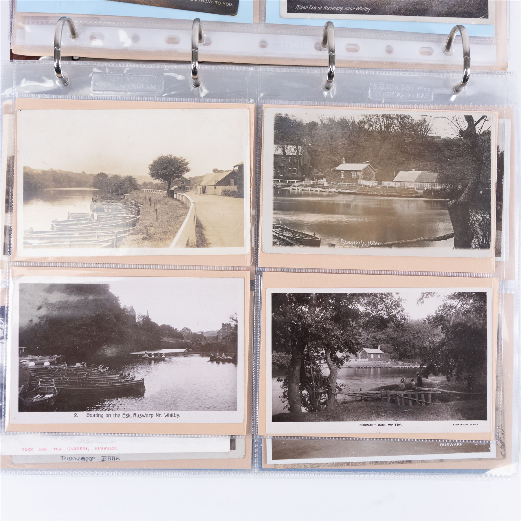 Four-hundred and twelve early 20th century Whitby District view real photographic postcards, including a selection from the Whitby Coast (176), starting at Staithes and Runswick Bay down to Robin Hoods Bay and a selection from the Valley of the River Esk (236), including Ruswarp, Rig Mill, Sneaton, Sleights, Grosmont, Egton, Glaisdale, Danby, Castleton and Goathland, all housed within two postcard albums