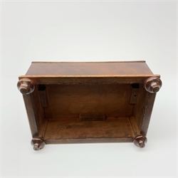 A Victorian mahogany foot stool, of rectangular form with four turned feet and Berlin wool work style padded top, L37cm. 