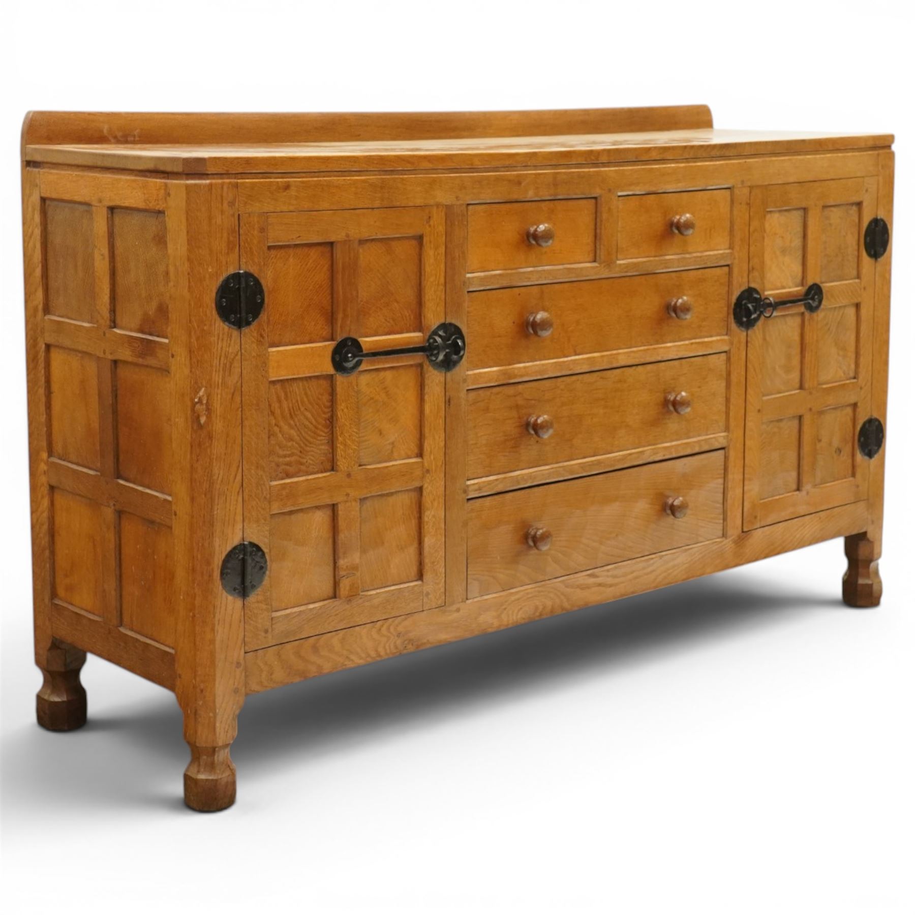 Mouseman - adzed oak dresser, rectangular top with galleried back, fitted with six drawers and two cupboards, blackened metal latches and circular hinges, with carved mouse signature, by the workshop of Robert Thompson of Kilburn
