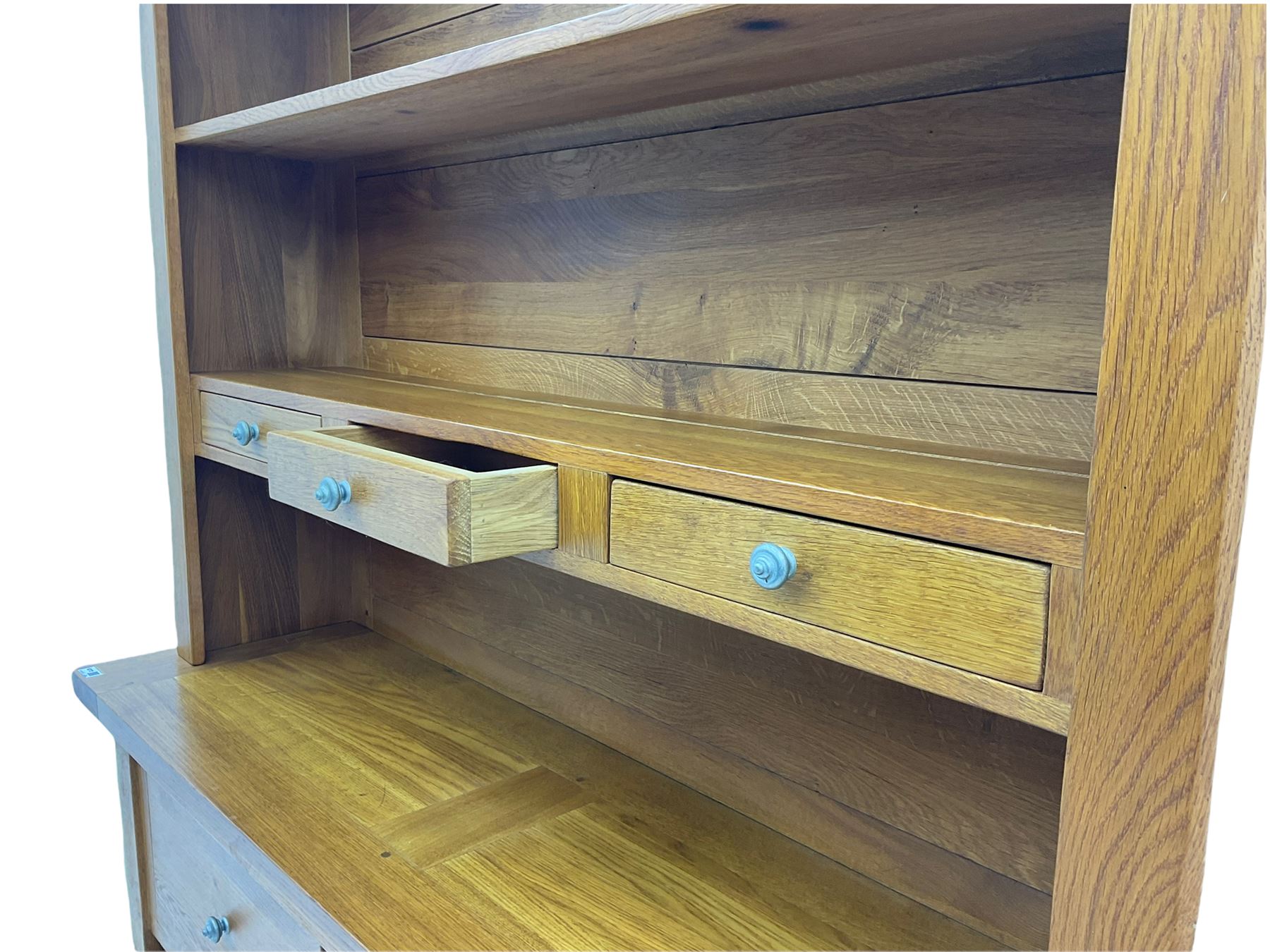 Manor Oak - light oak dresser and rack, fitted with two shelves with three drawers, two deep drawers and pot baked base with basket storage