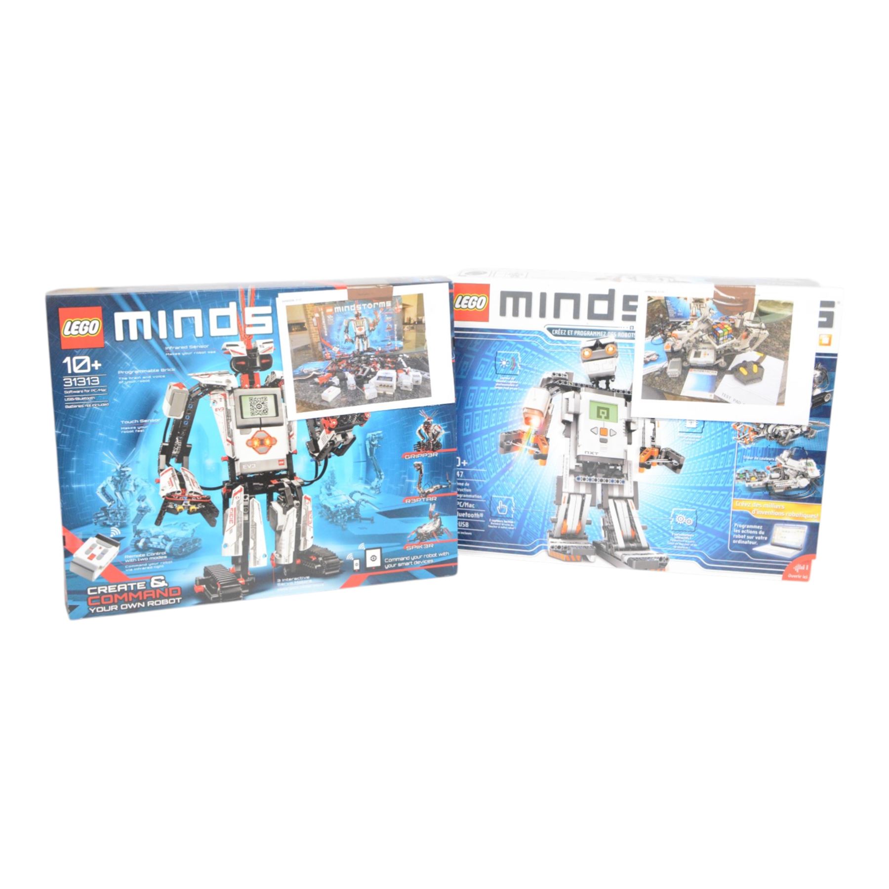 Two Lego Mindstorms sets, comprising 8547 NXT 2.0 and 31313 EV3, both partially built with boxes and instructions