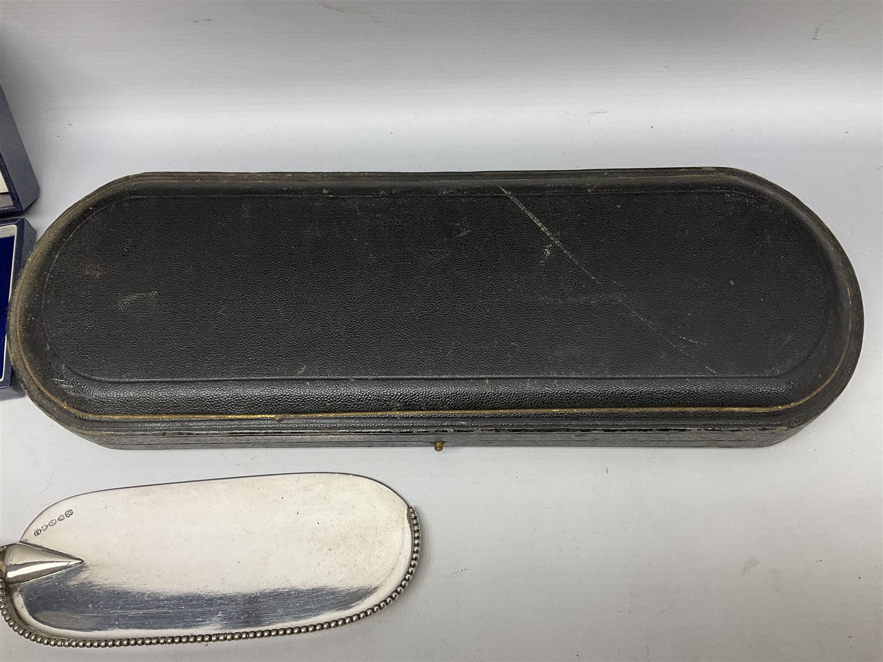 Cased pair of Wedgwood silver-plate book stands, silver-plate baby feeding spoon and pusher in box, other silver-plated cutlery