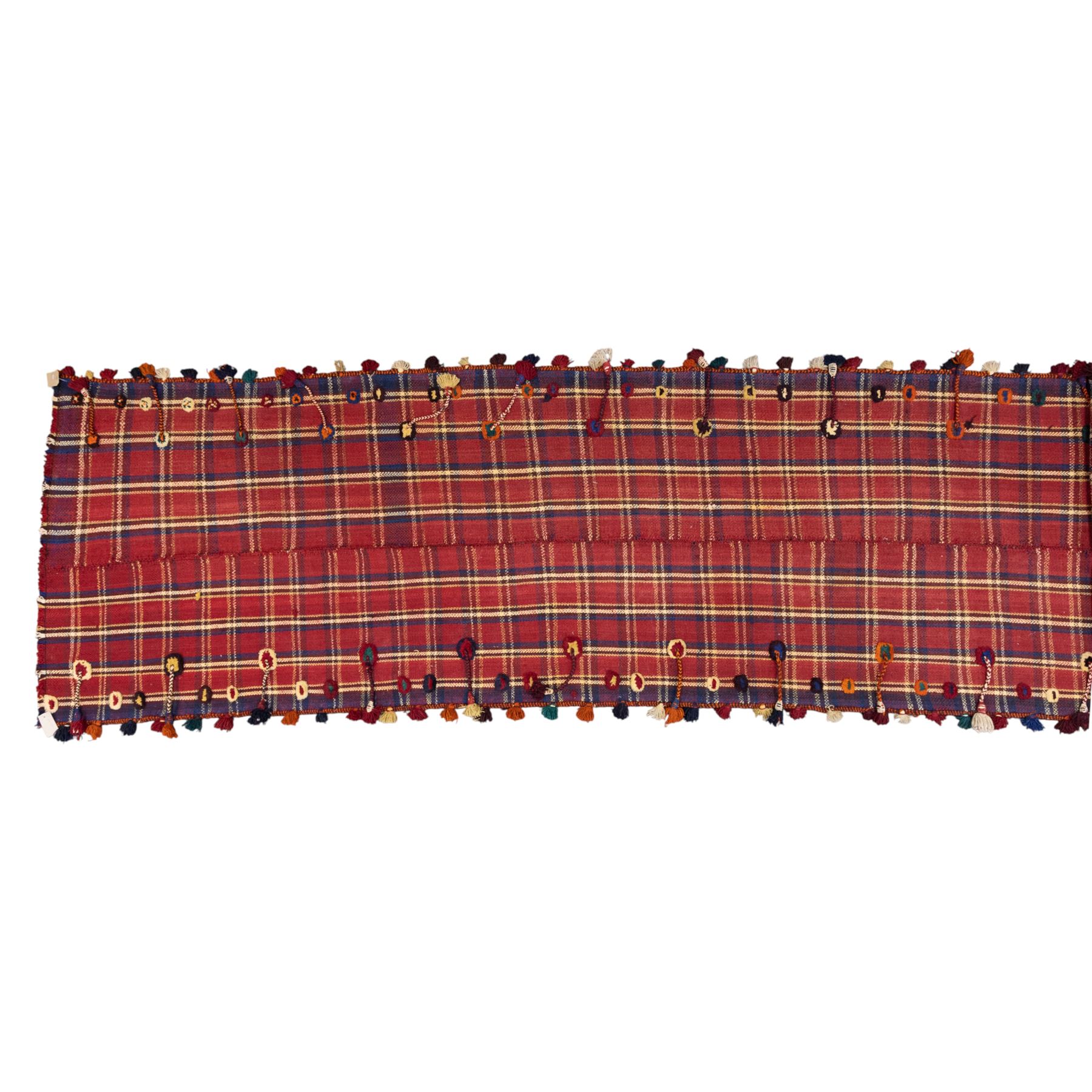 South West Persian Jajim kilim flatweave runner, composed of joined narrow woven bands,  field decorated with checked and striped motifs in shades of madder red, indigo, ivory ochre, and green, sides applied knotted wool tufts and braided elements with tasselled edges, (due to the large size, the runner is illustrated in two sections) 