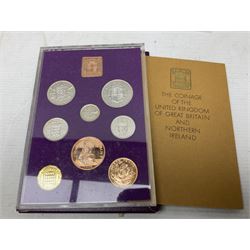 Coins and sets, including Great Britain and Northern Ireland 1970 proof coin collection in card folder, Queen Elizabeth II 2021 'Through the Looking Glass' five pounds, 2021 'Winnie the Pooh' fifty pence, Queen Victoria 1887 halfcrown, King George V 1914 halfcrown, commemorative coins, The Royal Mint Solomon Islands 2003 twenty-five dollars silver proof coin cased with certificate, 9ct gold half sovereign mount etc