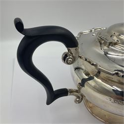 1920s five-piece silver tea service, comprising teapot, coffee pot, hot water pot, twin handled open sucrier and milk jug, each of squat circular form with shaped rim, the teapot, coffee pot and hot water pot each with ebonised handle and finial, the sucrier and milk jug with acanthus capped scroll handles, all upon circular foot, hallmarked R F Mosley & Co, Sheffield 1926 & 1927, tallest H24cm
