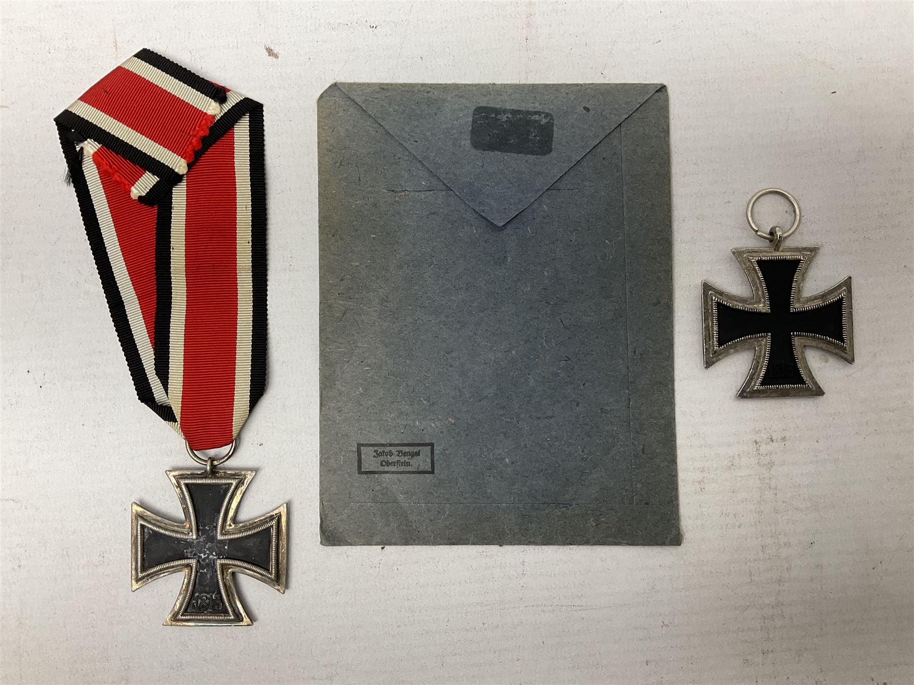WW2 German Iron Cross 2nd Class with ribbon, ring stamped 44; and original issue packet; together with a copy of a WW2 Iron Cross