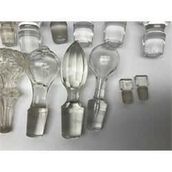 Quantity of glass decanter stoppers, of varying style and size, including hand blown and cut glass examples