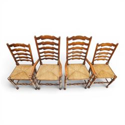 Set of eight country ladderback chairs (6+2), shaped ladderback over a rush seat, raised on turned supports, united by stretchers