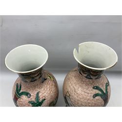 Pair of early 20th century chinese vases of baluster form with with trumpet neck, decorated with vase display upon a red whorl ground, H36cm 