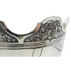 Late Edwardian silver Monteith bowl, the plain body with moulded foliate detailed and shaped rim, upon a circular stepped foot, hallmarked Selfridge & Co Ltd, London 1908, H17cm D21.5cm, approximate weight 31.64 ozt (984.4 grams)
