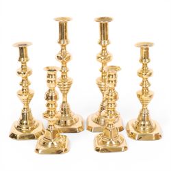 Pair of 19th century brass chamber candlesticks with detachable snuffers, together with three pairs of brass candlesticks 