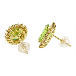 Pair of 18ct gold oval cut peridot and round brilliant cut diamond stud earrings, total peridot weight 3.00 carat, with World Gemological Institute report