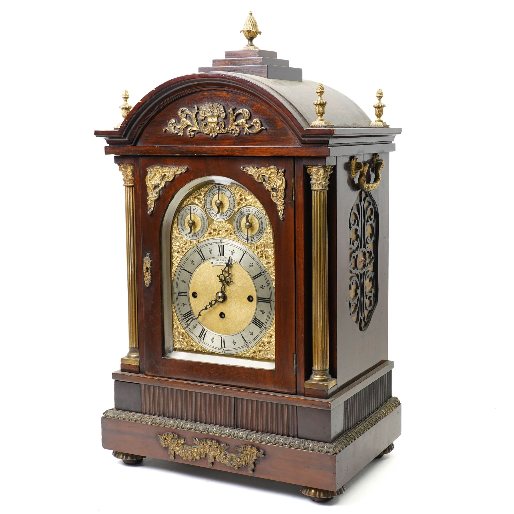 Late 19th century bracket clock with three train movement, Westminster Chimes on eight bells and gong strike, the brass dial inscribed 'Webber Liverpool' with gilt brass mounts in mahogany dome top case with pineapple finial, brass handles and classical columns on compressed circular feet H76cm