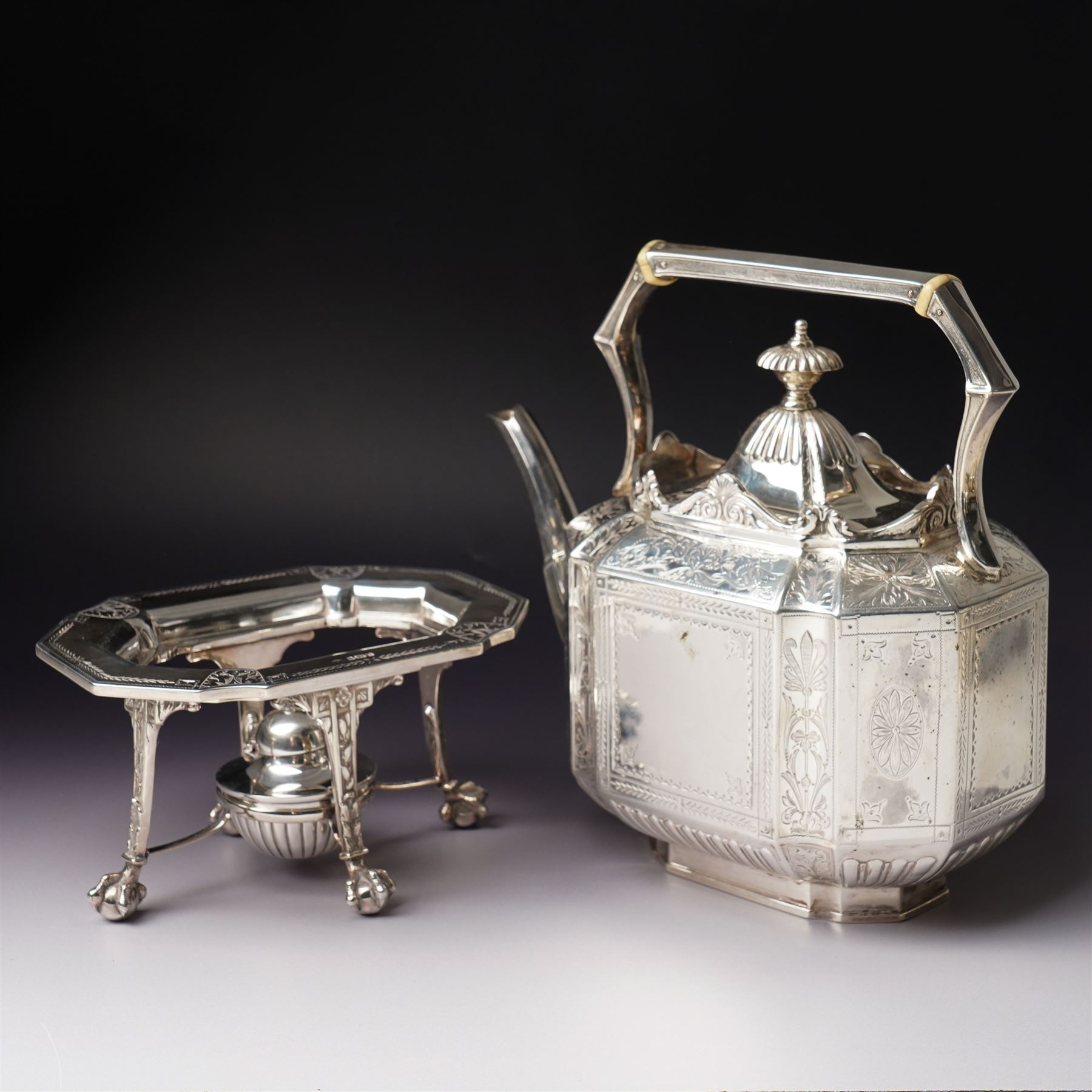 Victorian silver tea and coffee set engraved with classical urns, oval paterae and scrolling foliage, monogram and 'Diligentia et Honore' comprising teapot, tea kettle on spirit heater stand, coffee pot, two handled sugar bowl and cream jug Sheffield 1891 Maker John Round & Son Ltd