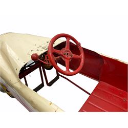 1950s child's tin-plate pedal car, possibly by Tri-ang, painted white and red and named 'Crusader' L104cm