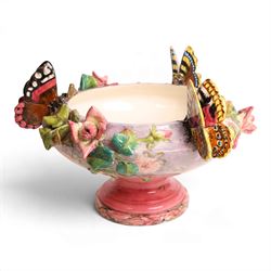 Delphin Messier (1836-1907), glazed earthenware cache-pot, decorated with three butterflies surrounded by floral and foliate motifs. upon a pink circular foot, signed beneath, H24cm