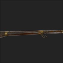 Middle Eastern percussion cap rifle, the 107cm  barrel with four brass bands and ramrod under, overall L143cm, together with another percussion rifle the 106cm barrel a copy of a 17th century Spanish barrel, complete with fake stamp, by vendors repute this rifle was confiscated from tribesmen in Kurdistan by police
Sold as an exempt item under Section 58 (2) of the 1968 Firearms Act, to be held as a curiosity or ornament
