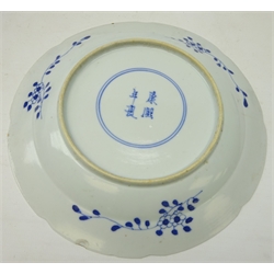  19th century Chinese export blue and white plate painted with segmented panels of long Elizas and blossoming branches, four character mark to base, early 20th century Japanese blue and white charger with pinched rim decoration and a Chinese bowl (3)  