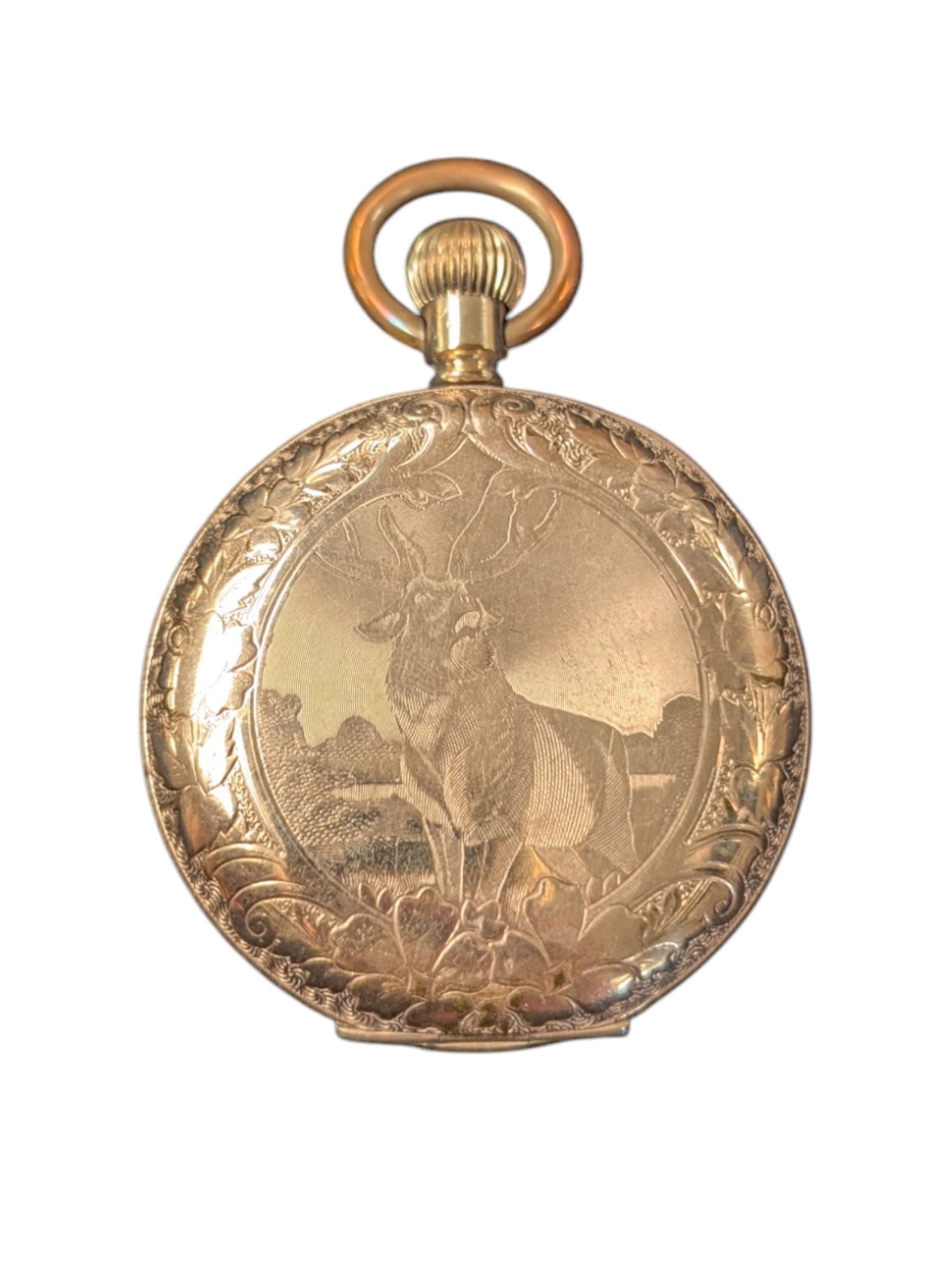 Waltham USA gold plated full hunter pocket watch, the white enamel dial with subsidiary seconds dial, the front cover engraved and embossed with blank cartouche in a floral border, the back cover engraved with stag