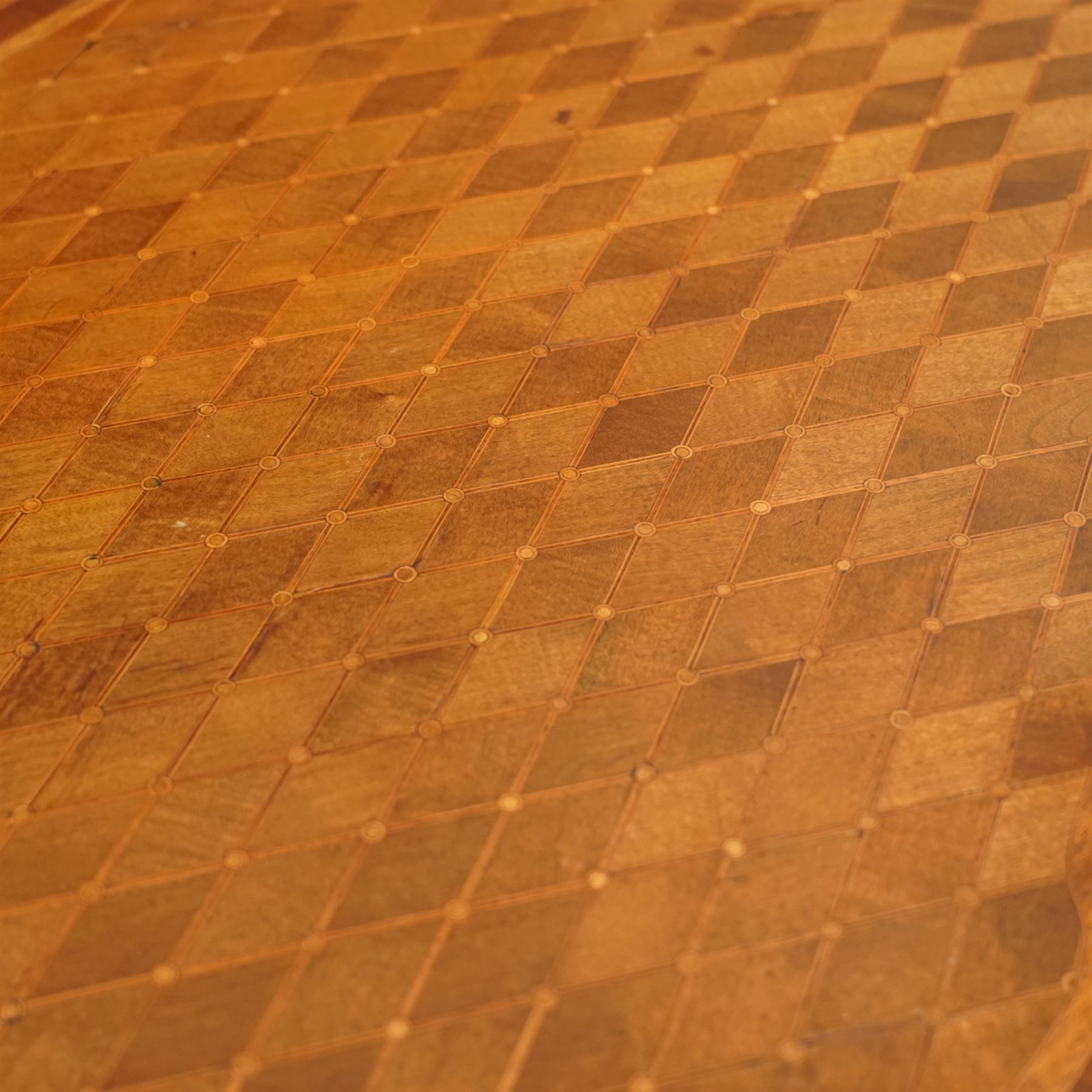 Late 19th-century Louis XV-style marquetry and gilt bronze-mounted kidney-shaped writing table, of serpentine form, top finely veneered with a trellis parquetry pattern, within a gilt bronze moulded edge, above a shaped frieze fitted with a central drawer flanked by two short drawers, similarly inlaid side and legs, knees with gilt bronze foliate mounts and cabriole legs terminating in gilt bronze sabots