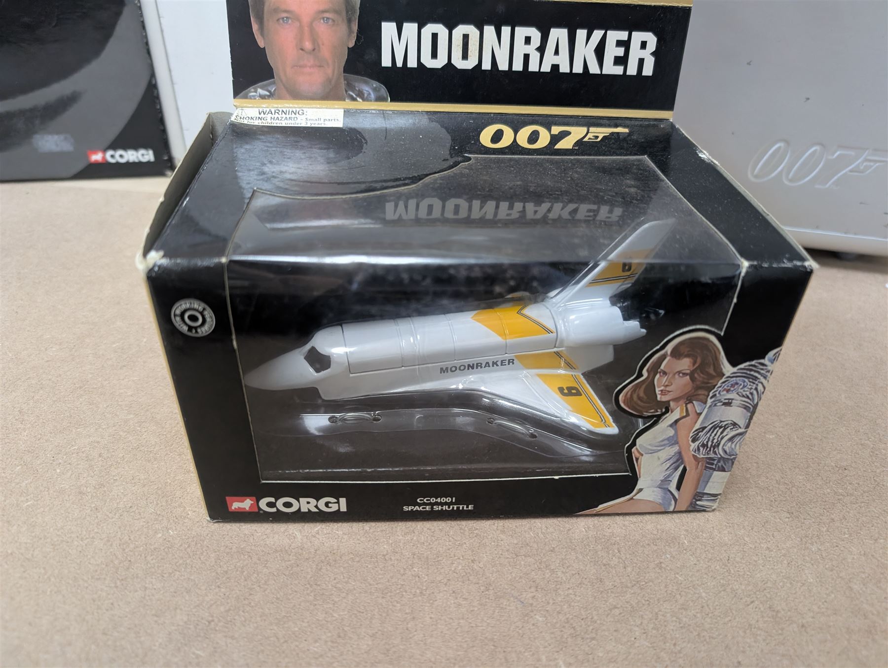James Bond DVD collection, housed in a 007 collectors briefcase, together with Corgi The Definitive Bond Collection Film Canister 4 Piece Set CC99106, Corgi James Bond Space Shuttle CC04001 and a Vanguard RAC special limited edition diecast model set, all boxed