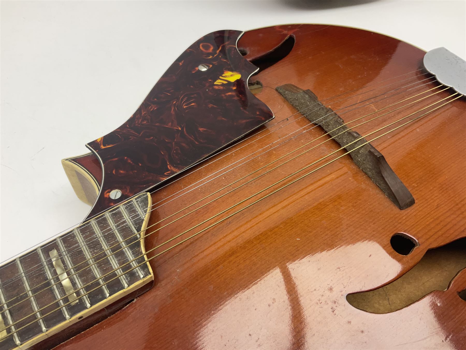 Eastern eight-string mandolin with sunburst finish and mother-of-pearl inlay L68.5cm; and another Harmony mandolin with cracked headstock (2)