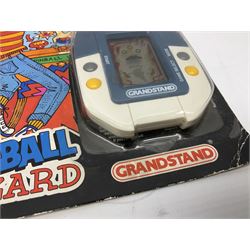 Collection of retro handheld games, including Nintendo Game & Watch ‘Snoopy Tennis’ (1982) and ‘Squish’ (1986) both with instruction booklets, Casio CG-600 ‘Star Invader’ with box, 3 in 1 LCD cartridge game including ‘Soccer’, ‘Invader’ and ‘Bomb Finder’ games, and two Grandstand ‘Pinball Wizard’ (1988) games, both with original boxes