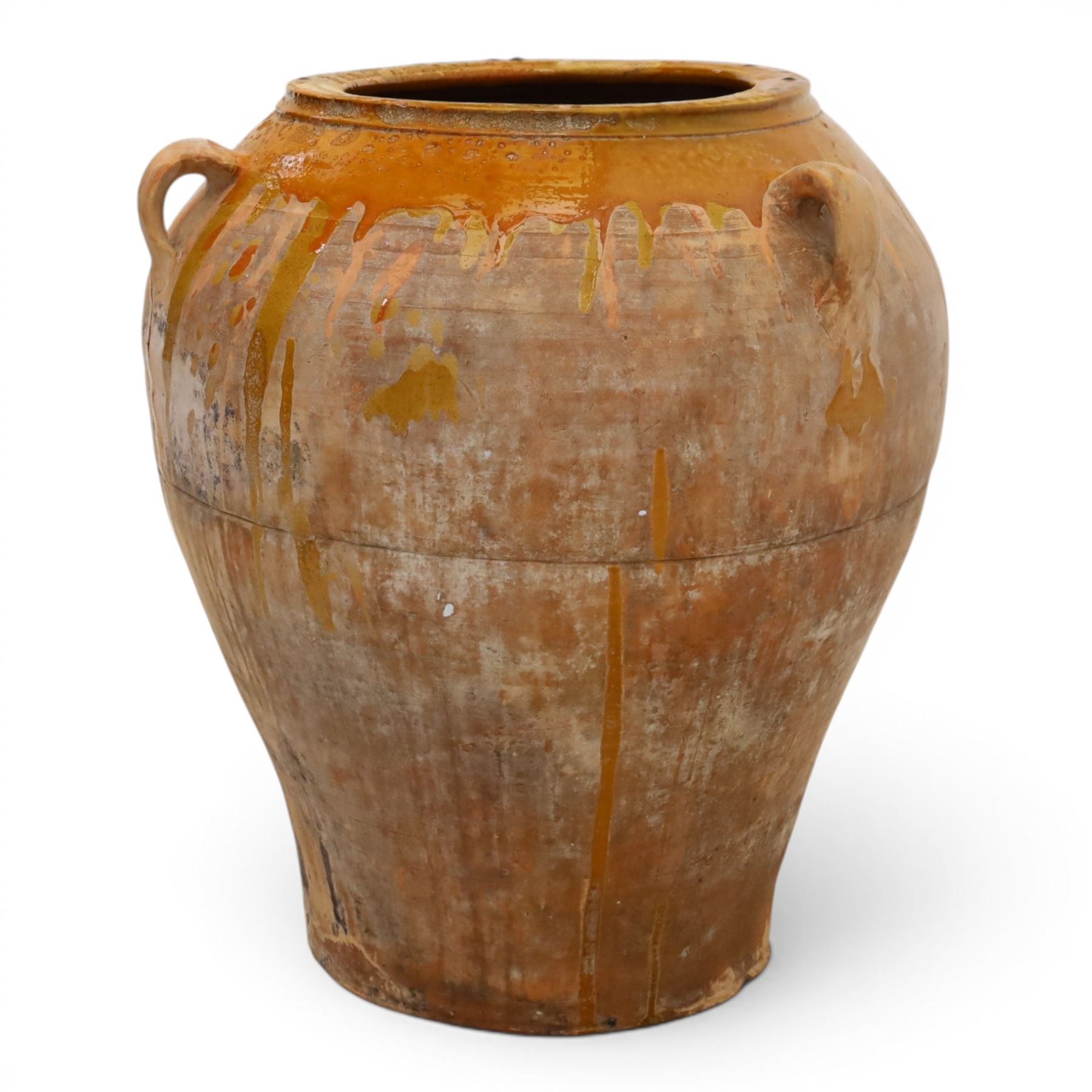 Large Spanish terracotta olive jar, of typical baluster form with drip glaze decoration and three lug handles, with impressed mark fabrica de alfareria, H58cm