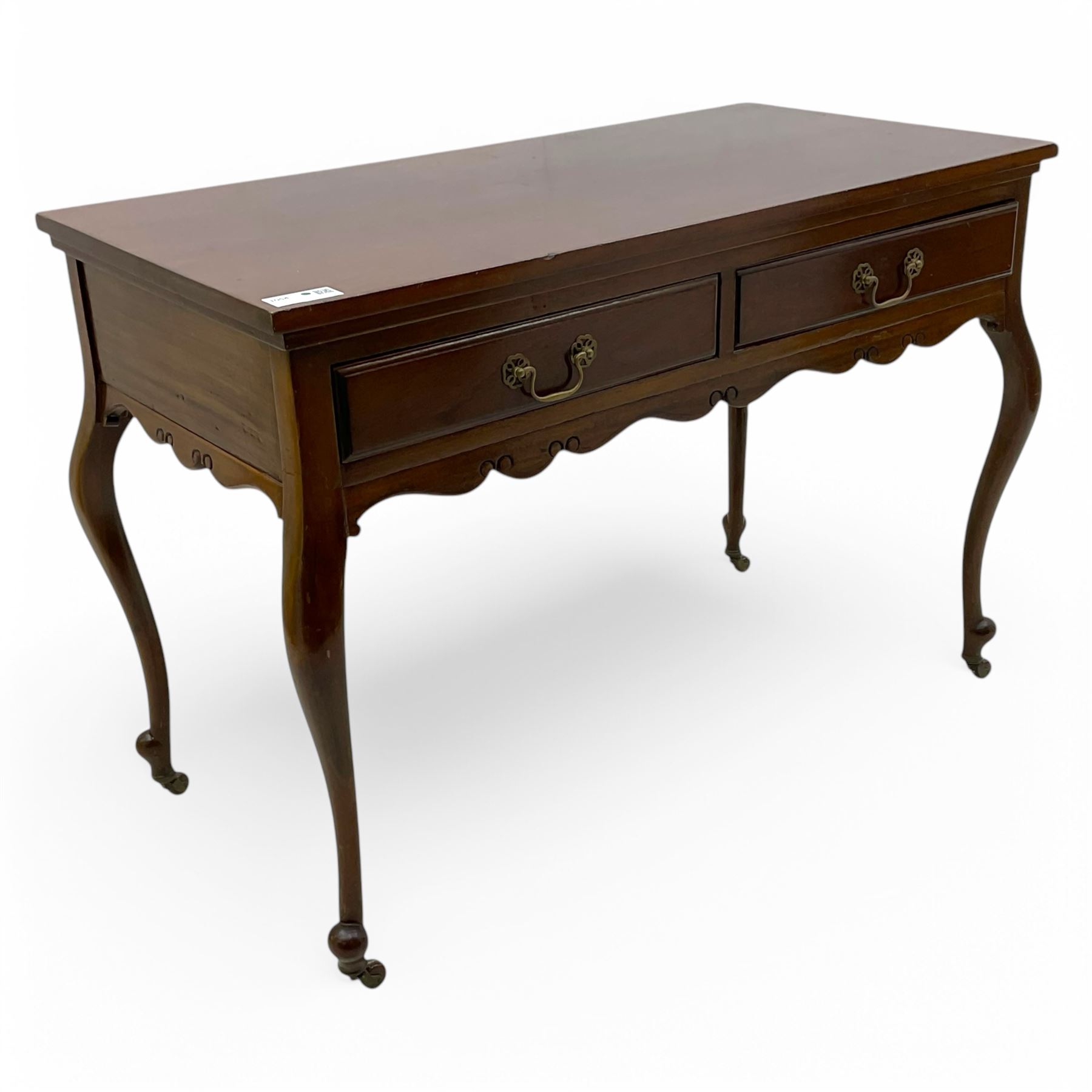 Late Victorian mahogany side table, rectangular top over two drawers and shaped apron, on cabriole supports with brass and ceramic castors