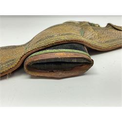 Late 19th century Yemeni Tuza jambiya as worn by religious elite, the 20.5cm curving blade with raised medial ridge, the horn hilt with pique style studwork, in a leather wrapped wooden scabbard with pierced metal mount and leather belt applied with embroidered 'gold' and 'silver' thread work panel; dagger L36cm overall, belt L84cm