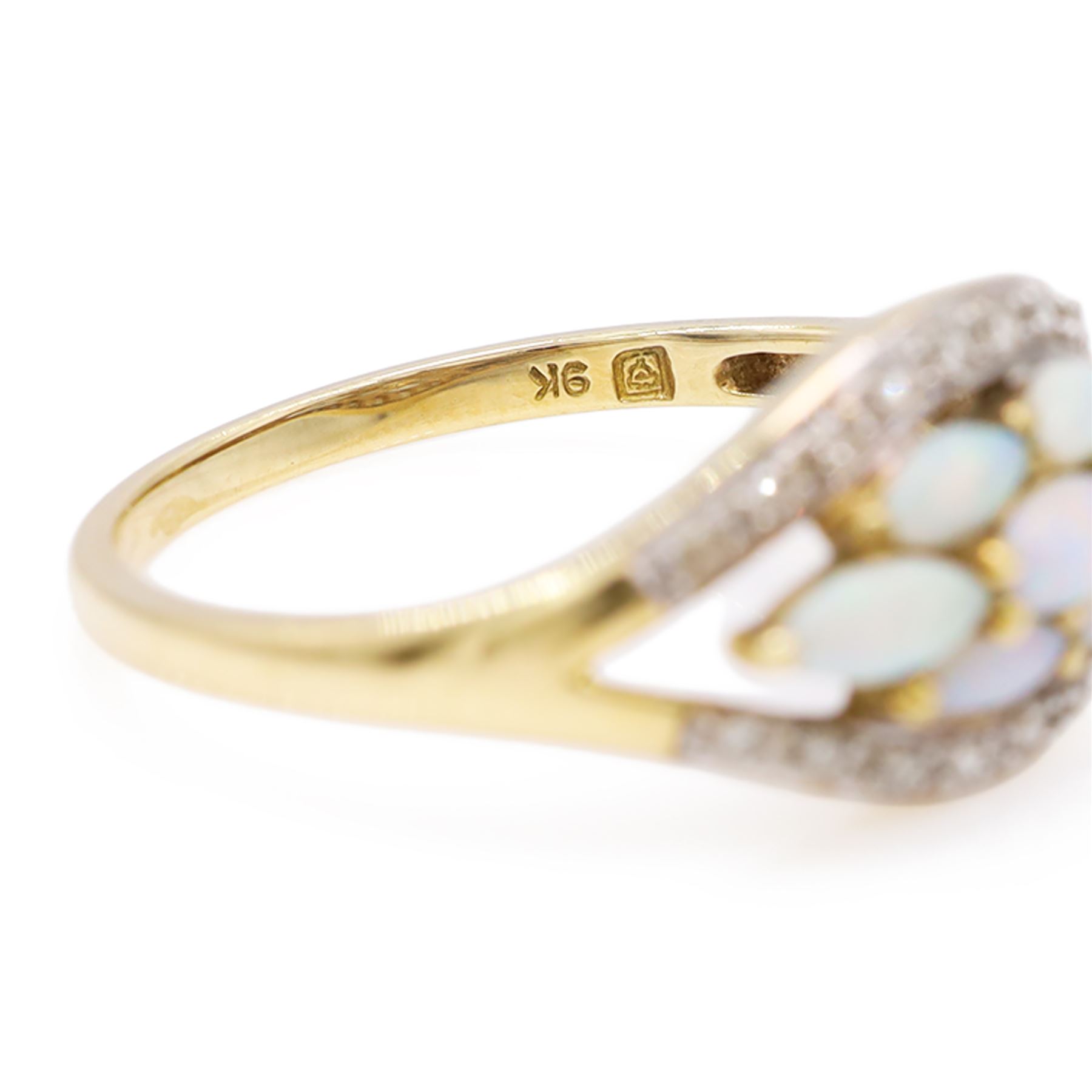 9ct gold opal and diamond cluster ring, seven marquise cut opals, surrounded by diamond chips, in a pierced design setting, Birmingham 2004