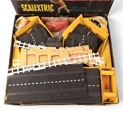 Tri-ang Scalextric Model Motor Racing set C.M.3, with five Tri-ang Scalextric slot car models, including Lotus 1961 in blue, Lotus 1961 in green, Typhoon motorbike and sidecar, B12 Hurricane motorbike and sidecar and Aston Martin DB4 GT,  all boxed, together with Merit Racing Car Assembly Kit, kit built Revell Model Racer Mercedes Benz 300SL Coupe, part built Revell Triumph TR4, Indi-Novi-Ferguson slot car and other accessories 