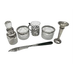 Miniature silver trumpet vase and cup holder, silver mounted glass scent bottle, pair of silver mounted open salts and a silver butter knife with hardstone handle, all stamped or hallmarked 