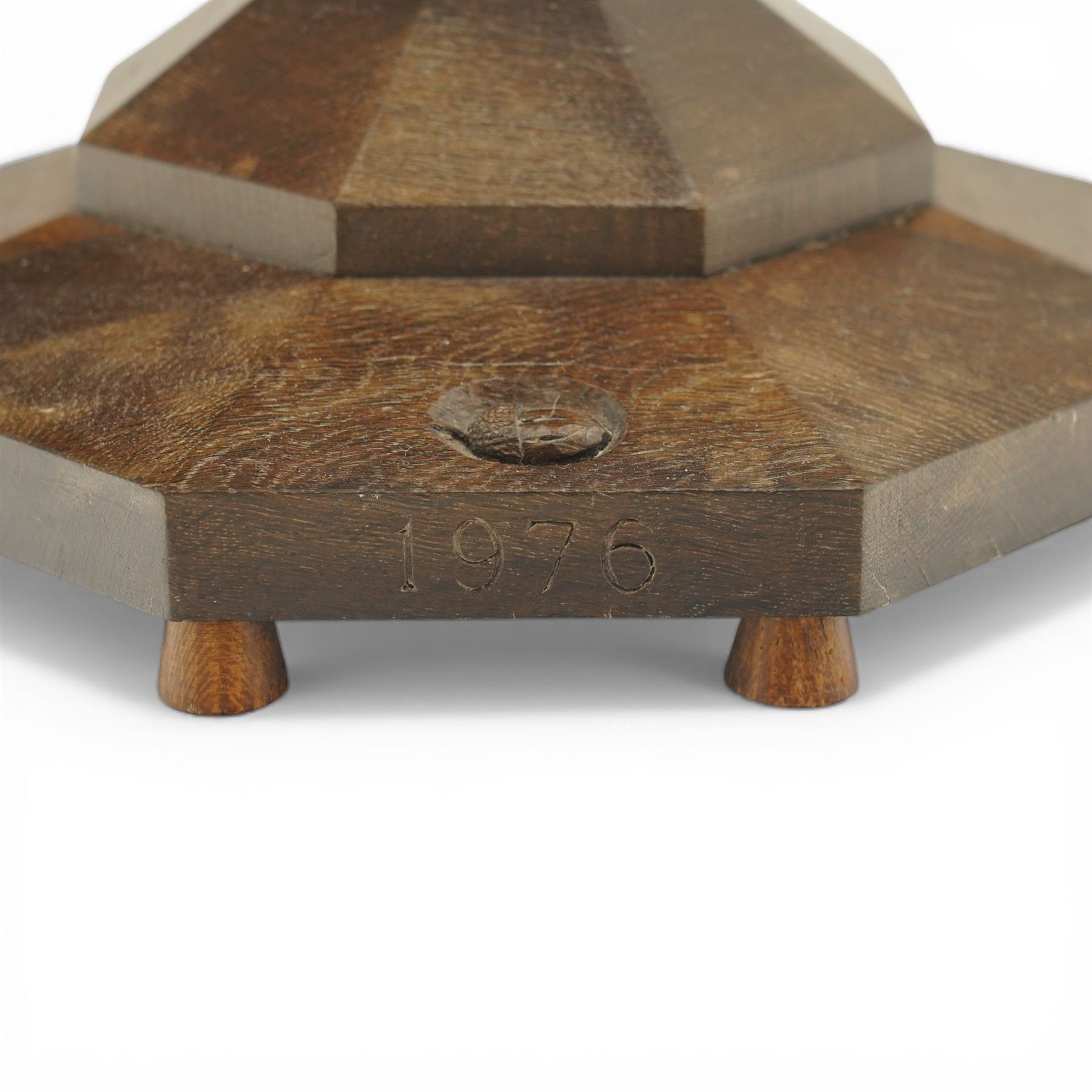 Acornman - dark stained oak standard lamp, supported on an octagonal column terminating in an octagonal base, with carved acorn signature, by the workshop of Alan Grainger of Brandsby 