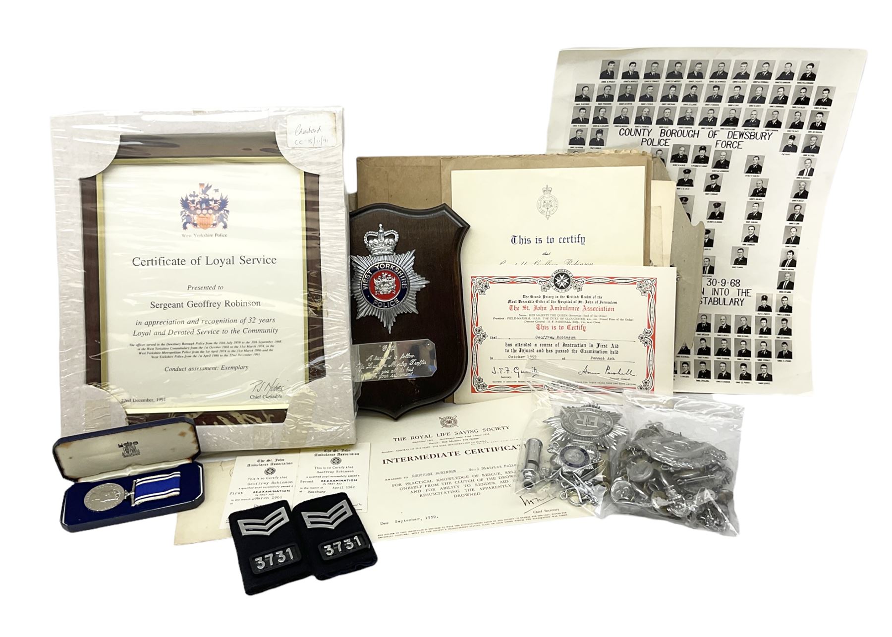 Archive of memorabilia and ephemera relating to Pc. (later Sgt.) Geoffrey Robinson of Dewsbury (later West Yorkshire) police force including cased Long Service and Good Conduct Medal; helmet plates and cap badges, collar numbers and uniform buttons, whistles, certificates, photographs, plaque etc 1960s - 1990s
