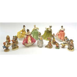 A group of figurines, comprising five Royal Doulton examples, Southern Belle HN2229, Simone HN2378, Coralie HN2307, Fair Lady (Coral Pink) HN283, and Fair Lady HN2193, a Lladro figure, six Hummel figurines, and four Royal Worcester bird figurines. 