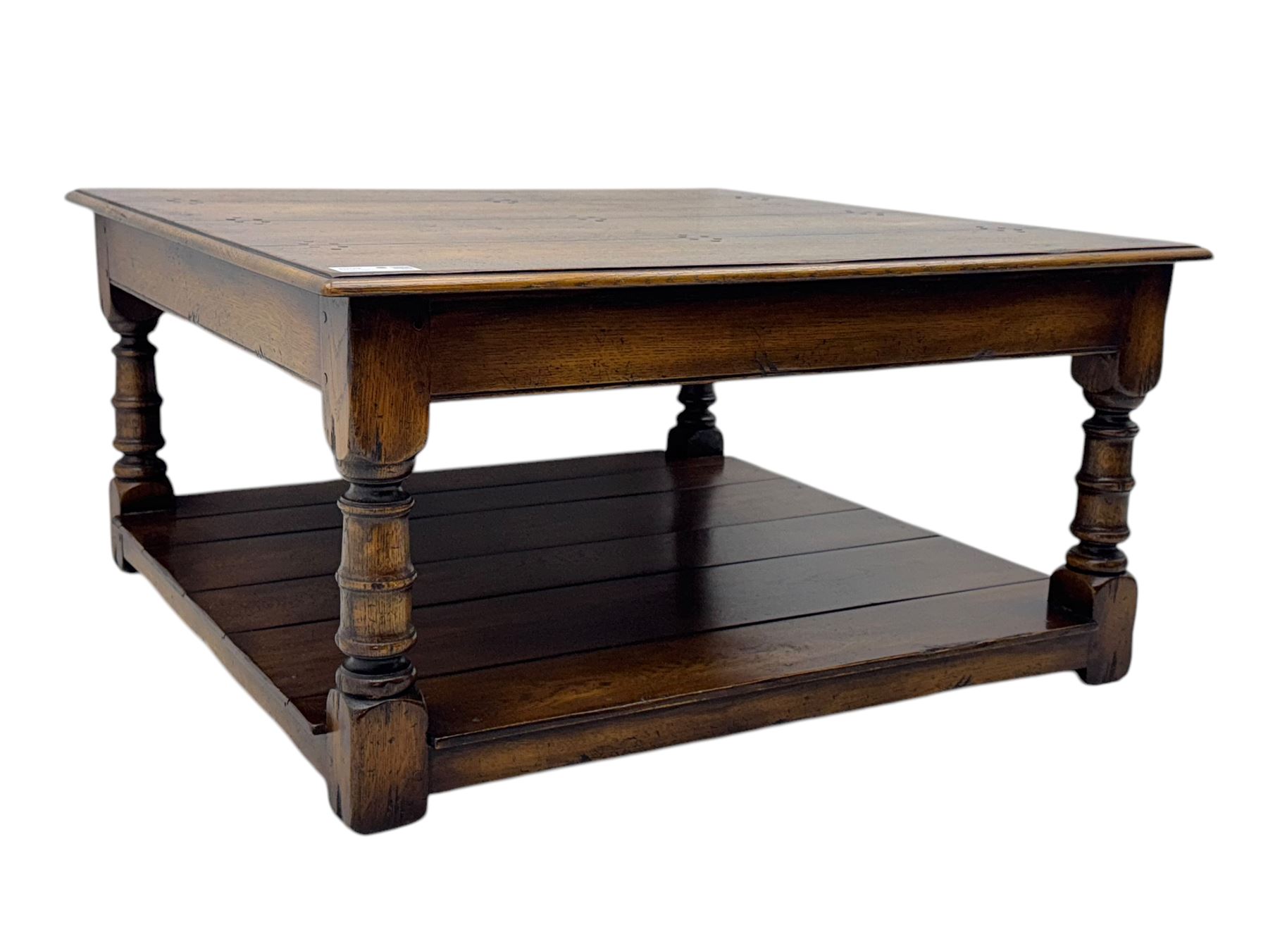 Oak coffee table, square moulded top on turned supports united by undertier 