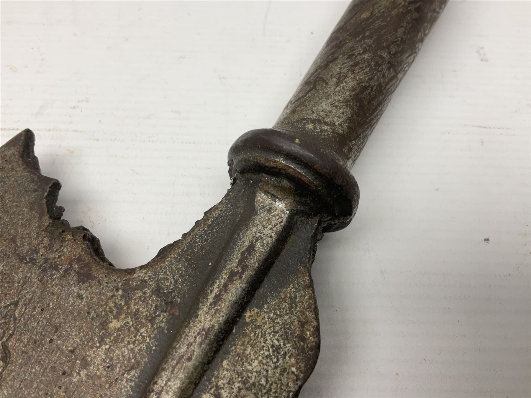 Moroccan jambiya dagger with 24.5cm plain curved blade stamped LONDON to the ricasso area, the hilt and scabbard overlaid with plain sheet brass to the back and ornate silver coloured metal to the front; waisted grip and arched pommel; two pyramid mounts to the scabbard L41cm overall; large billhook with curving blade and stacked leather washer grip; and a reproduction halberd blade (3)