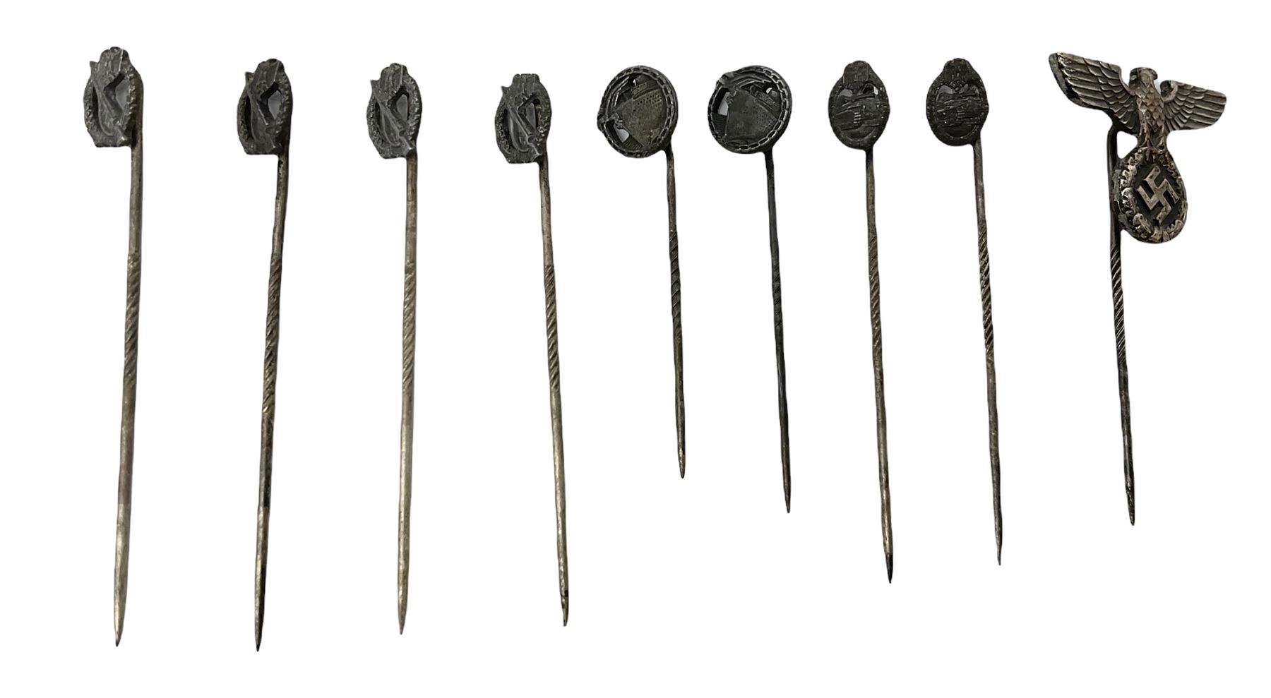 Nine WW2 German lapel pins including five Infantry Assault, Tank Assault etc 