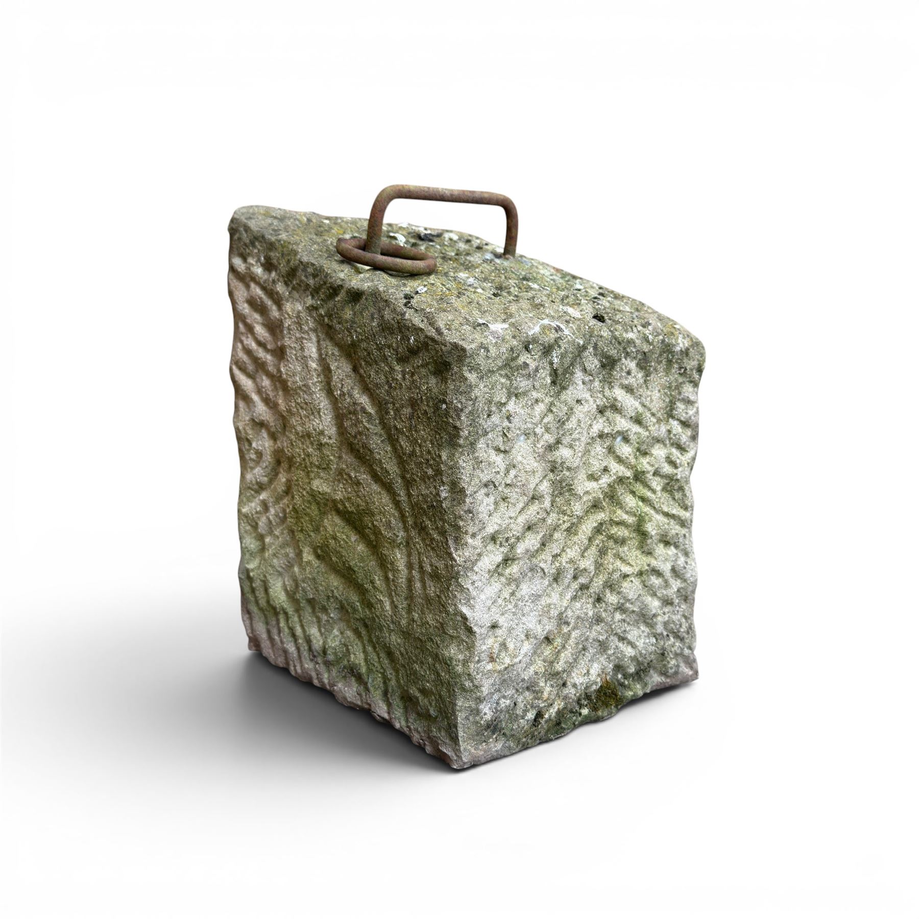 19th century carved tethering stone, square sloping form with iron work loop