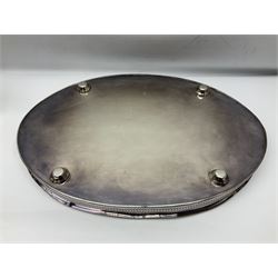 Pair of Mappin and Webb silver plate pierced pedestal bon bon dishes, together with other silver plate comprising teapot stand engraved with lion's head to centre, two cut glass claret jugs, two bottle coasters with acorn decoration, two open salts upon dolphin mounts, tea caddy, three piece cruet set and a large oval tray with pierced sides and upon four ball feet