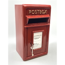 A reproduction red painted cast iron Postbox, H43.5cm, W24cm, D23cm. 