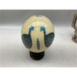 Ostrich egg painted with birds upon wood base and quantity of ceramics to include Toby Jugs, Royal Doulton character jug, horse models, musical stein, flowers etc
