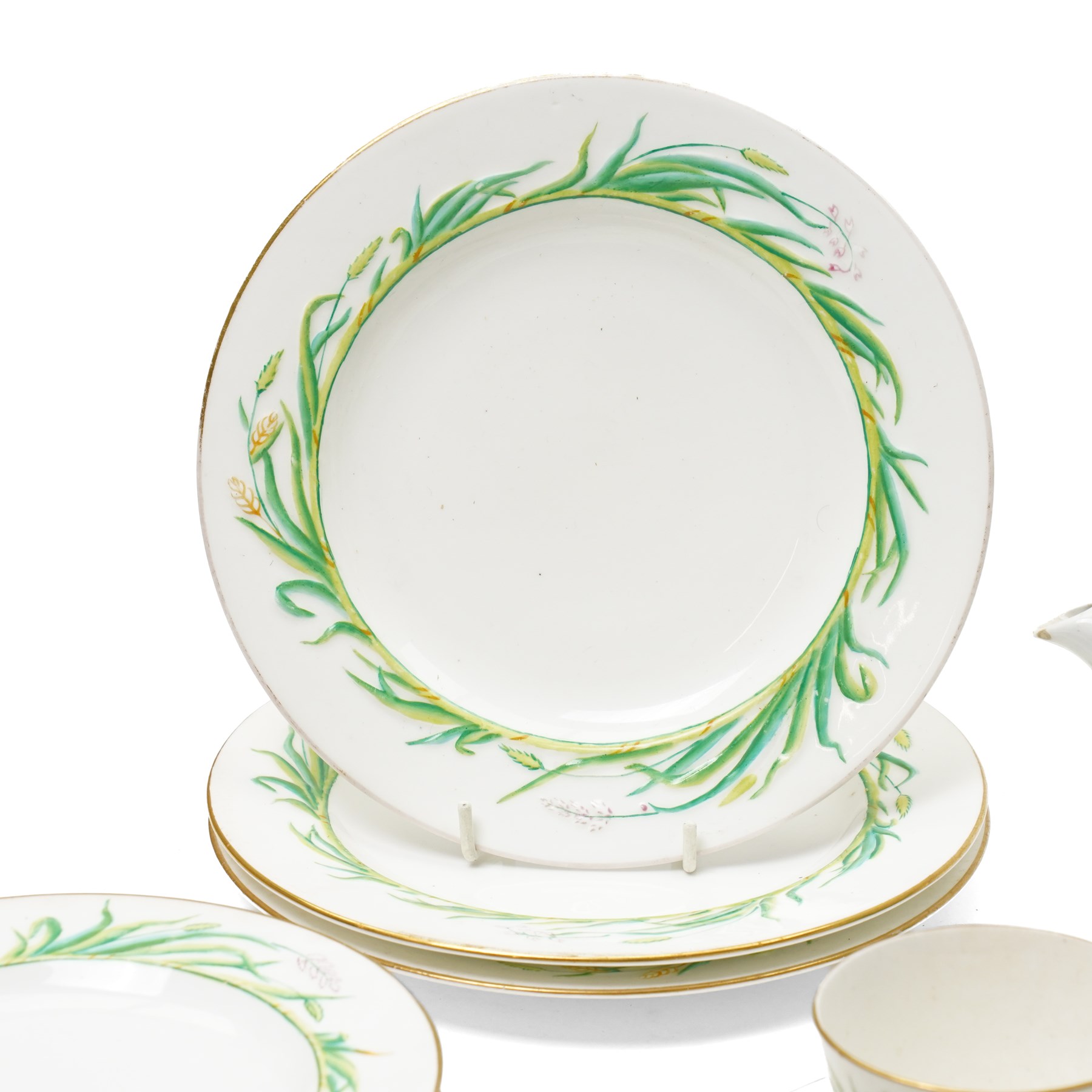 Victorian Copeland part tea service, painted in a Spring pattern with hay and flowers, comprising nine teacups and eleven saucers, teapot, milk jug, two large serving plates and three smaller and twelve side plates