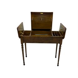 Edwardian oak metamorphic 'Britisher Writing Table', rectangular hinged top revealing correspondence compartments and hinged writing surface with underside storage, flanked by twin hinged compartments with dividers, on turned supports