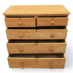 Victorian waxed pine chest, fitted with two short and three long drawers, turned wooden handles, raised on plinth base