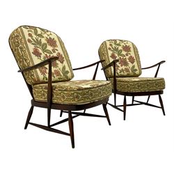 Ercol - Pair of mid-20th centur medium elm framed easy chairs, with loose patterned covers with folate design