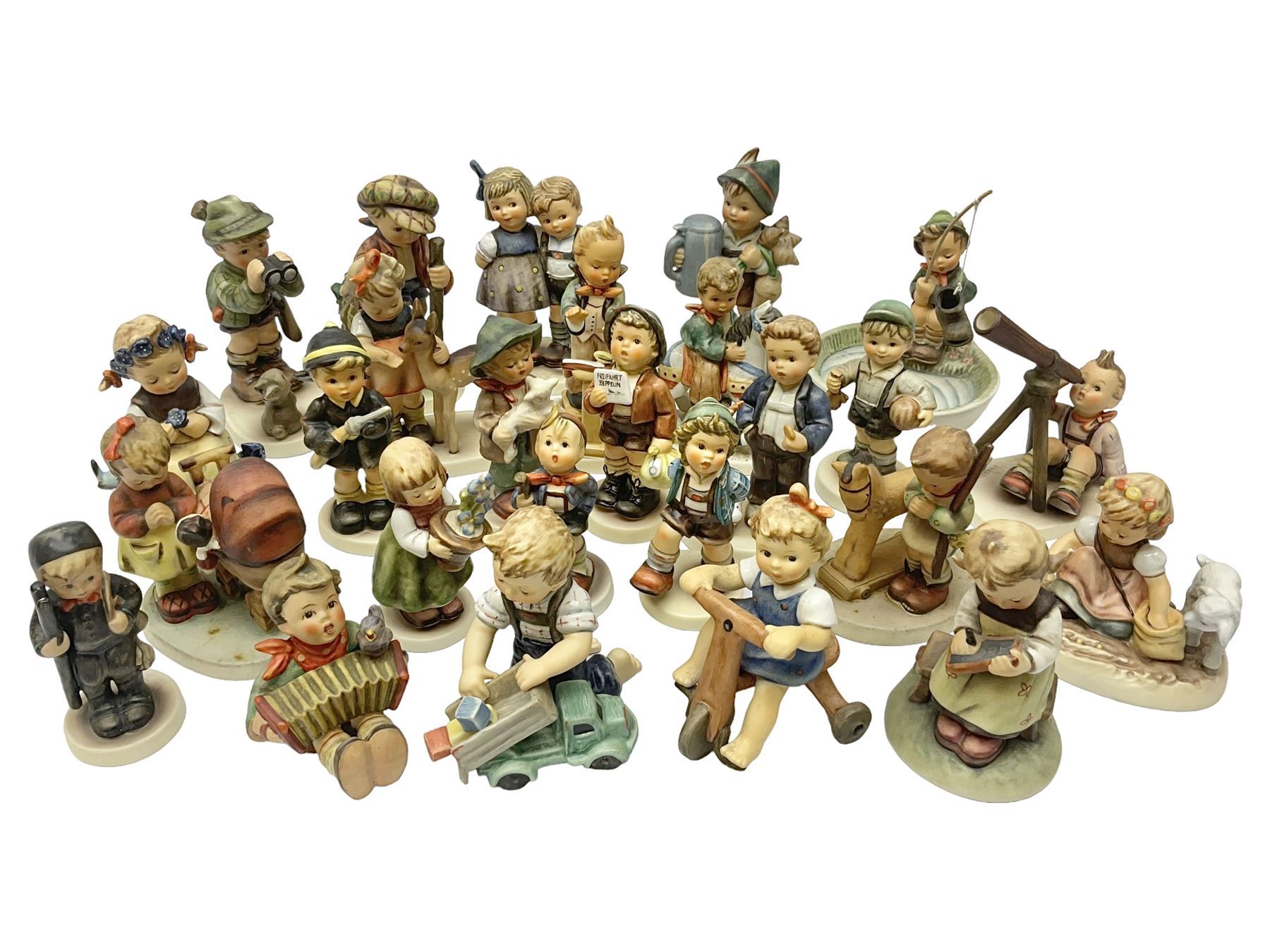 Twenty six Hummel figures by Goebel, to include Fire Fighter, Band Leader and Spring Sowing